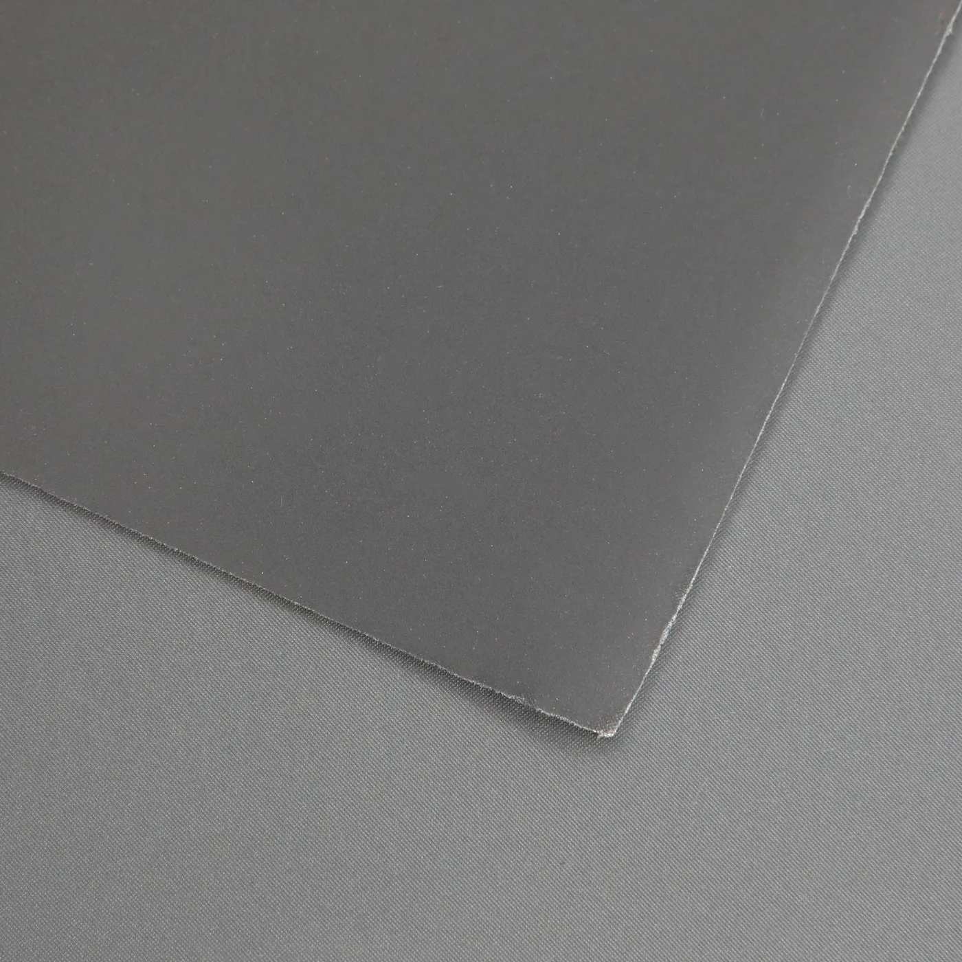 Hot-Cut Reflective Leather — material sample photographed on white