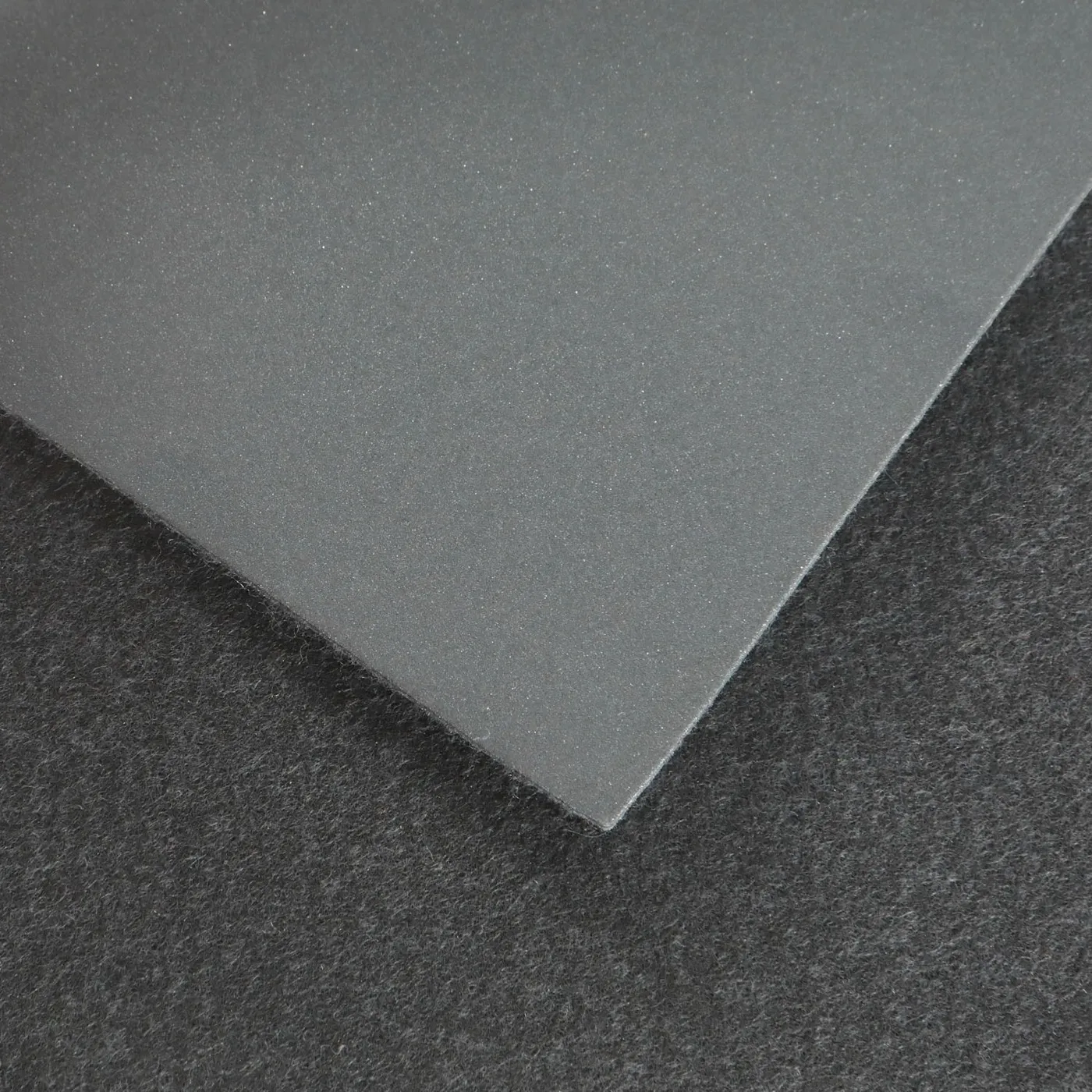 Space Reflective Leather — material sample photographed on white